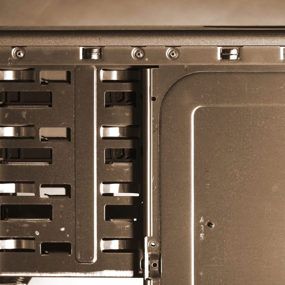 A close-up view of a sepia-colored steel computer case 