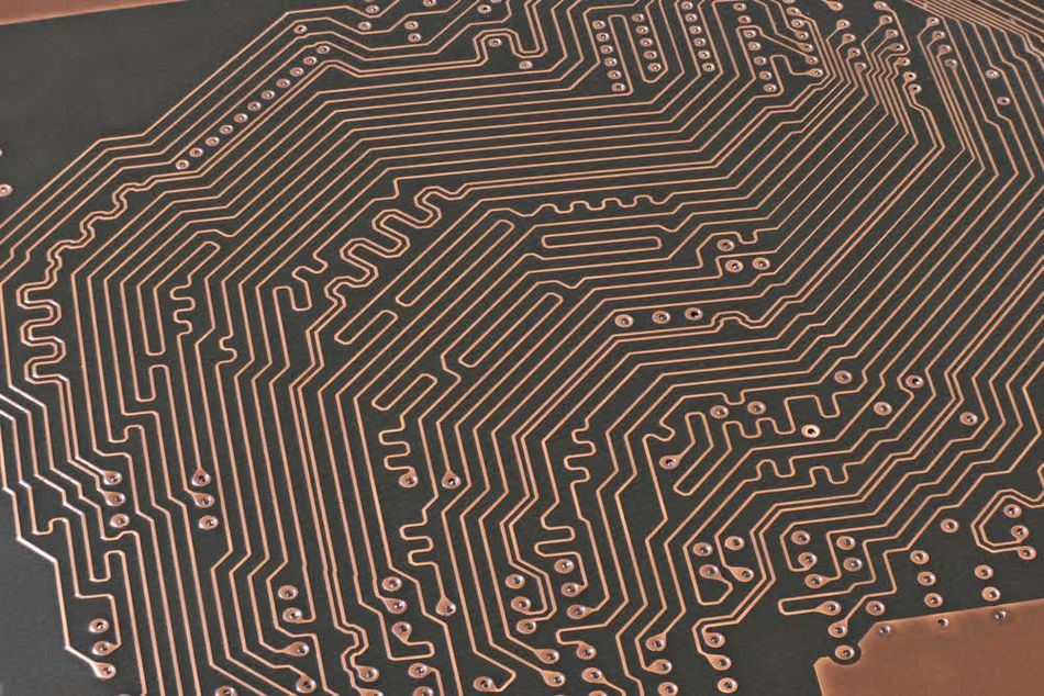 Copper traces terminating at vias to connect to another PCB layer