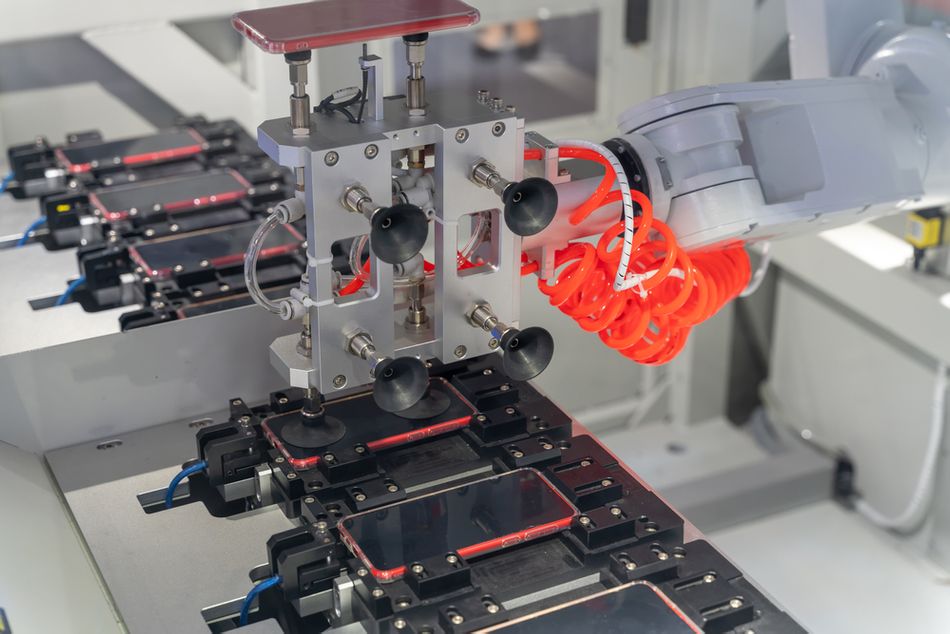 Robotic Arm Manufacturing Smartphone Cover in Industry
