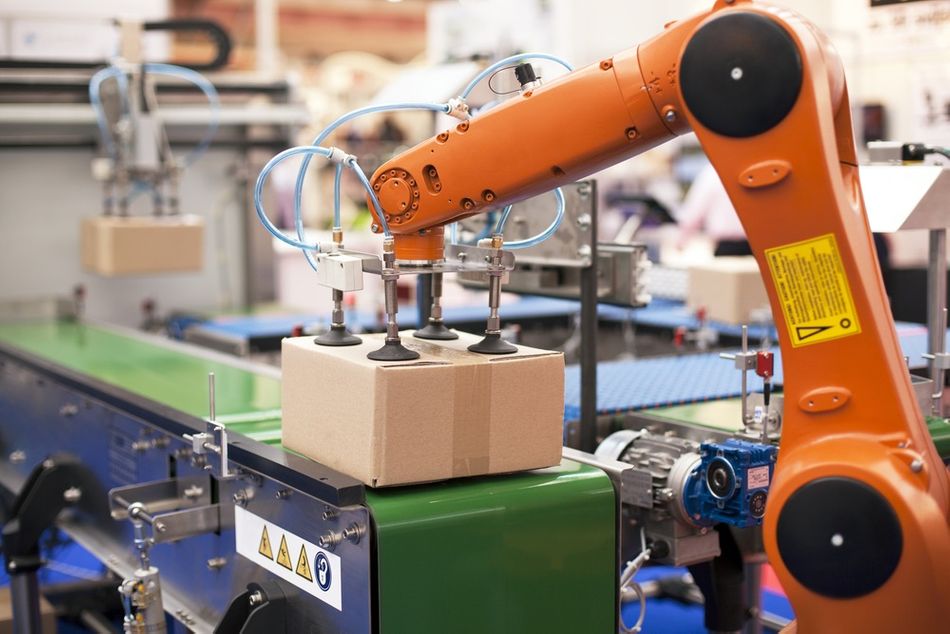 A robotic arm in a packaging line