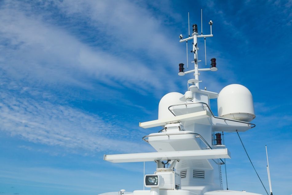 Radar and navigation system mounted on the mast of a large yacht