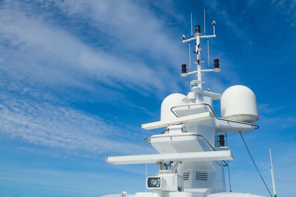 Radar and navigation system mounted on the mast of a large yacht