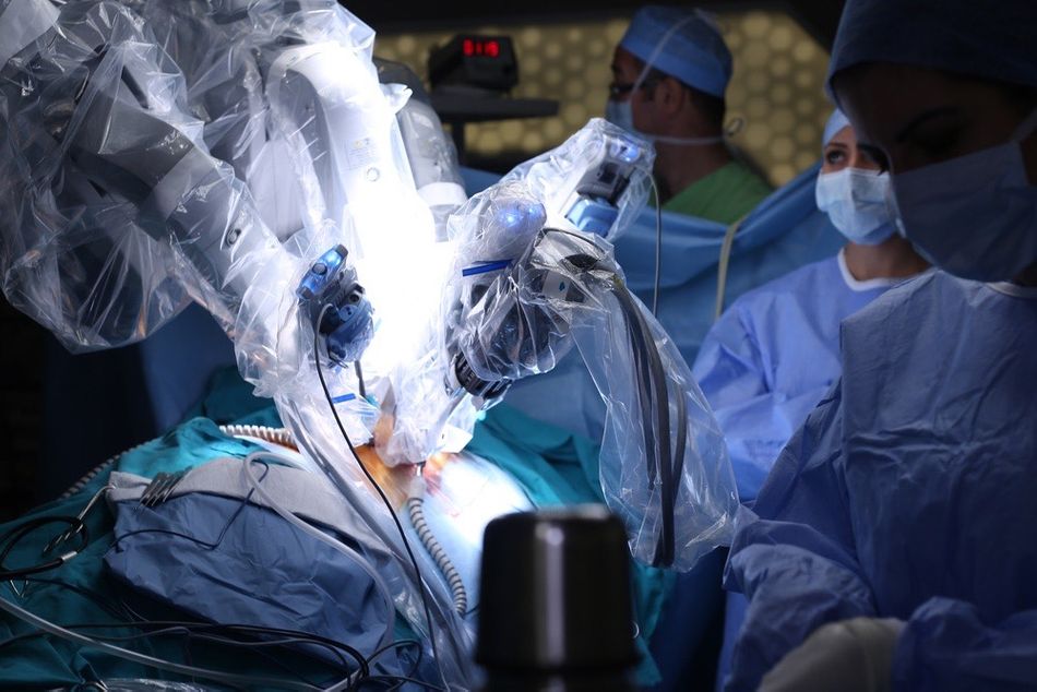 Surgeons using a surgical robot during a medical procedure