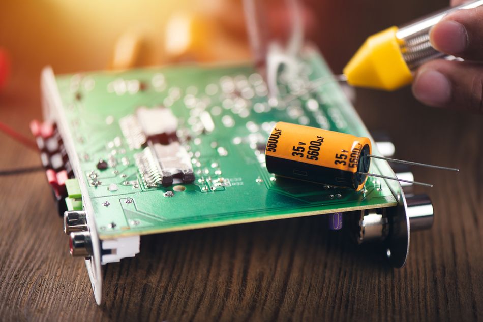 Technician repairing the Audio Amplifier