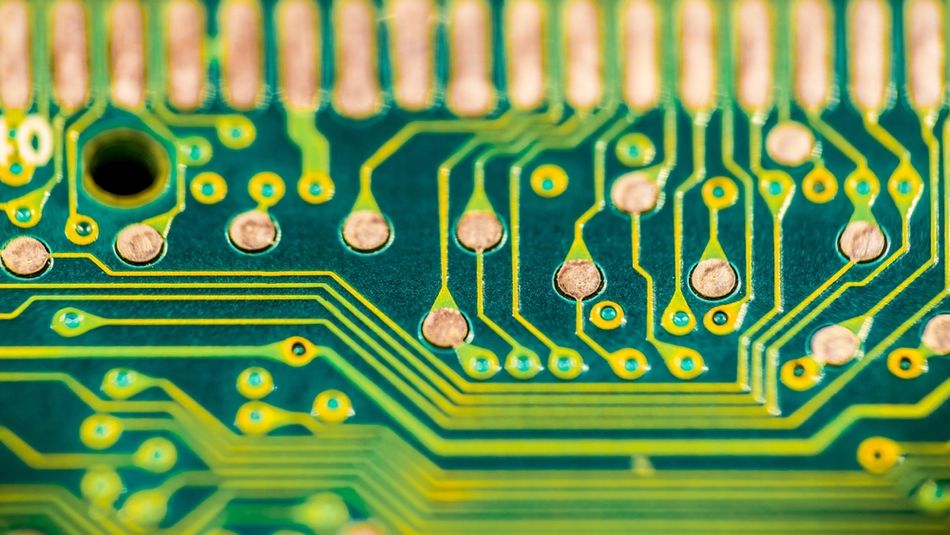 Solder Mask, and Copper Traces on Green PCB