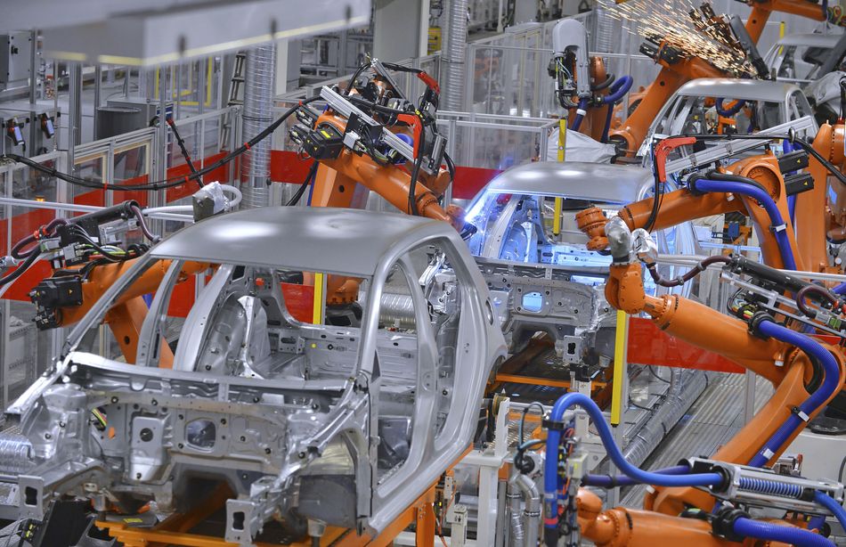 Robots Welding in a Modern Car Production Facility