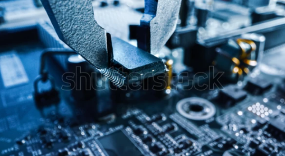 A pick and place robot places an SMT package IC on a PCB