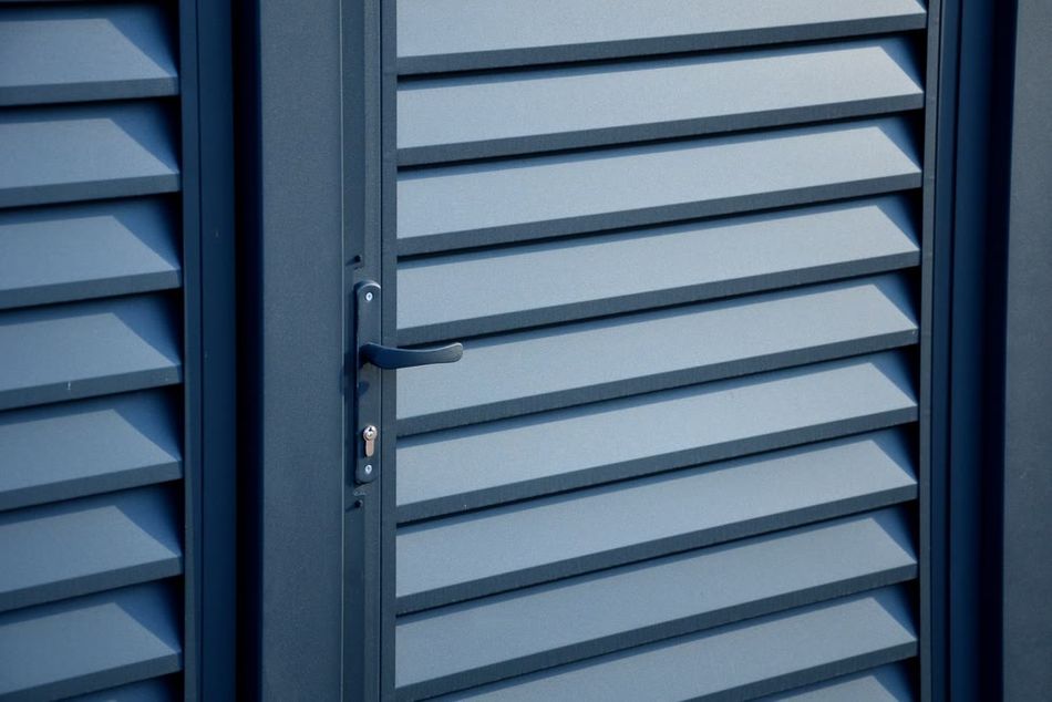 A chamfered metal enclosure to improve air flow and ensure water drainage without damaging internal parts