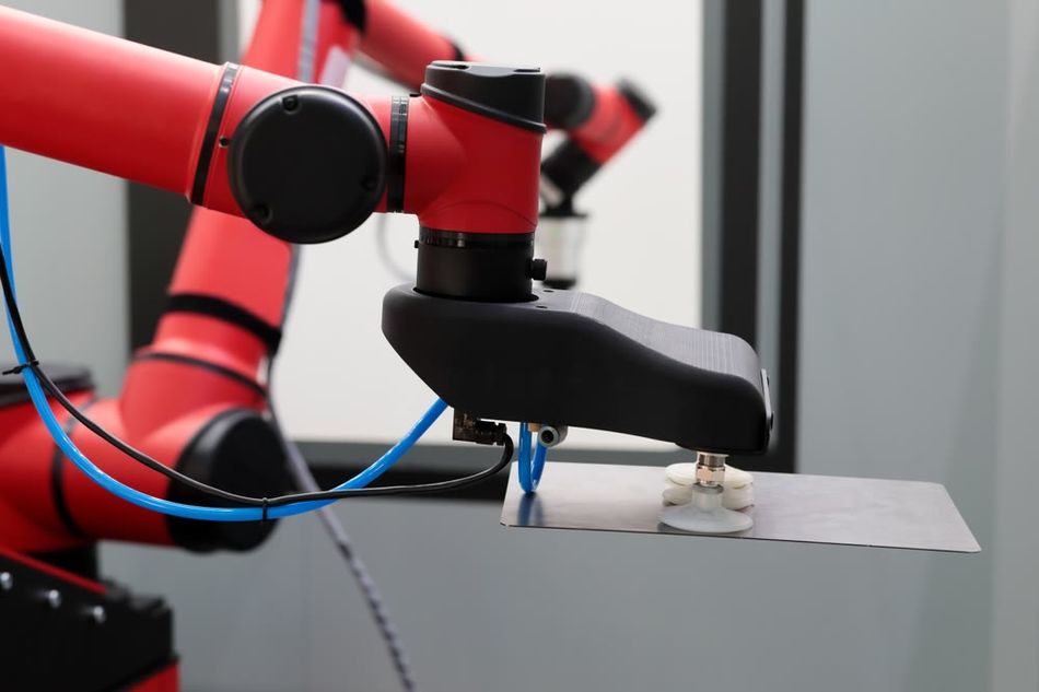 A robotic arm with a suction type end effector for pick and place applications