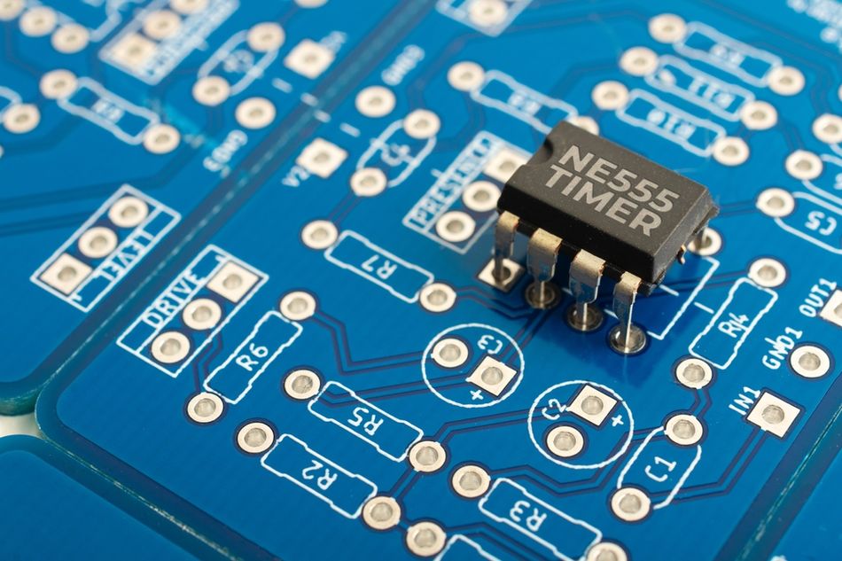 NE555 Timer Integrated Circuit on a Blue PCB
