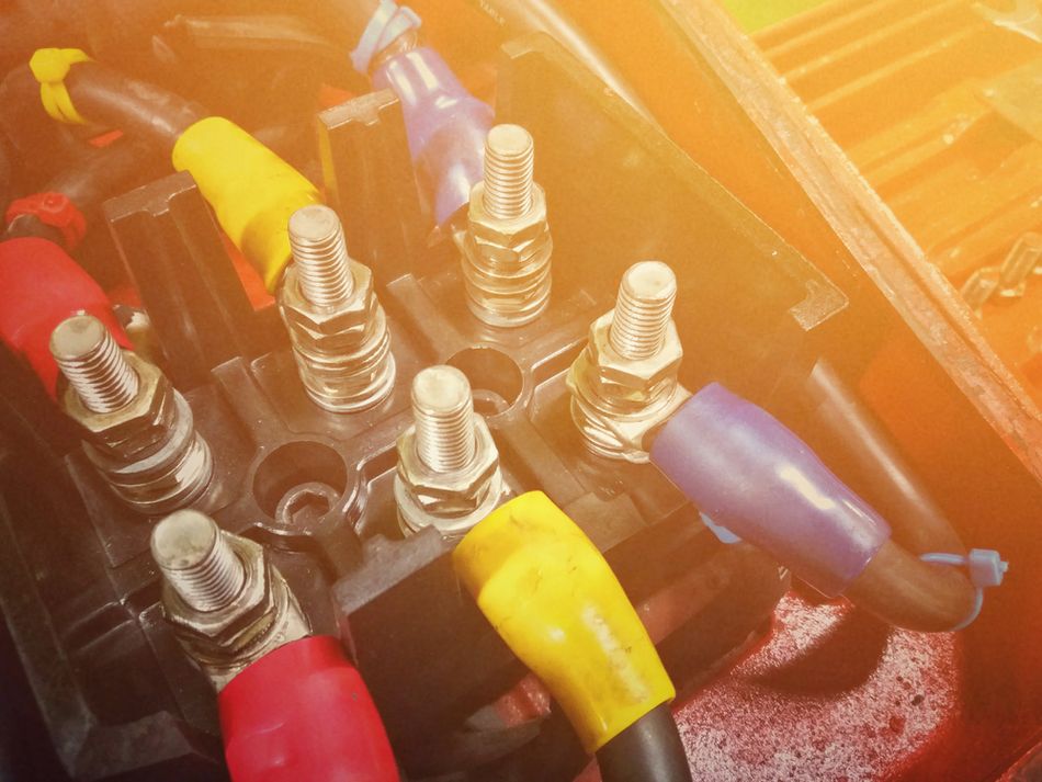 Electric motor box featuring color coded supply wires for a 3-phase motor