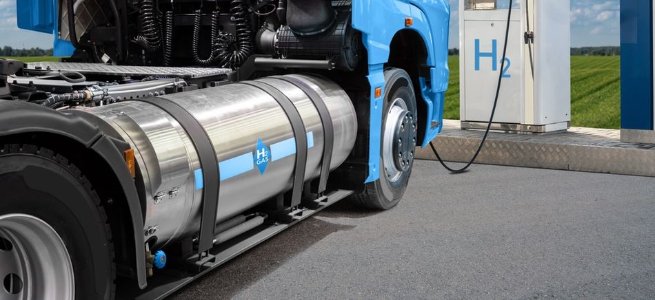 Hydrogen Fuel Cell Semi Truck with H2 Gas Cylinder Onboard next to Filling Station