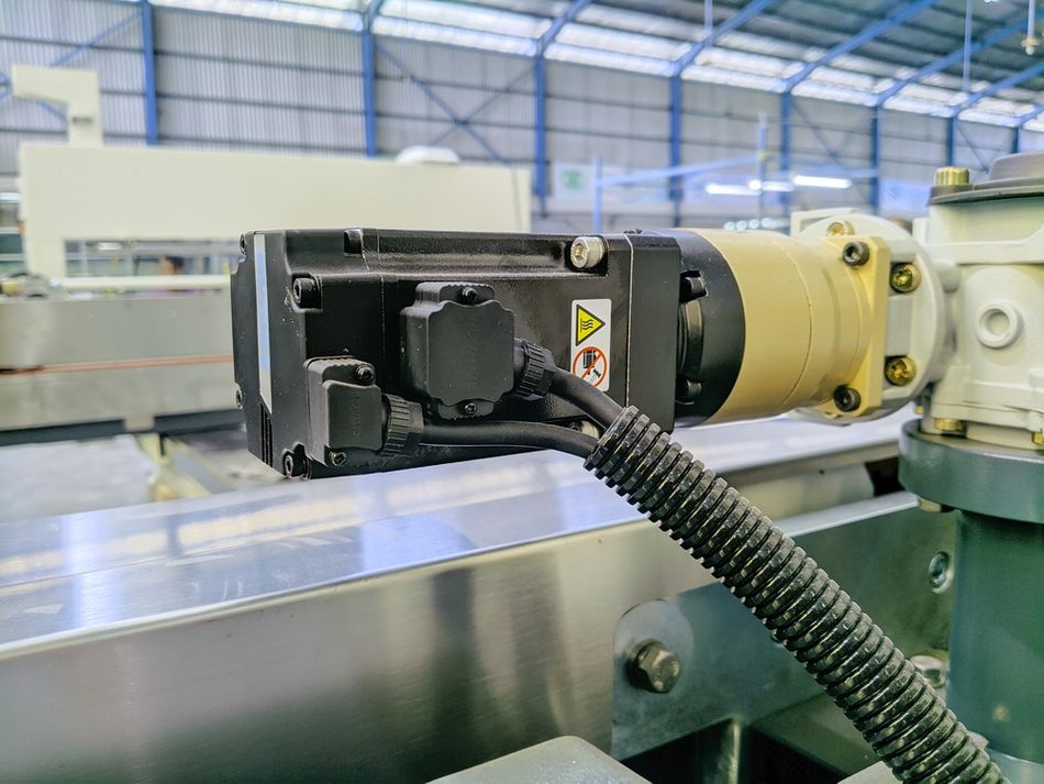 Industrial Electric Servo Motor attached to a Mechanical Gearbox System