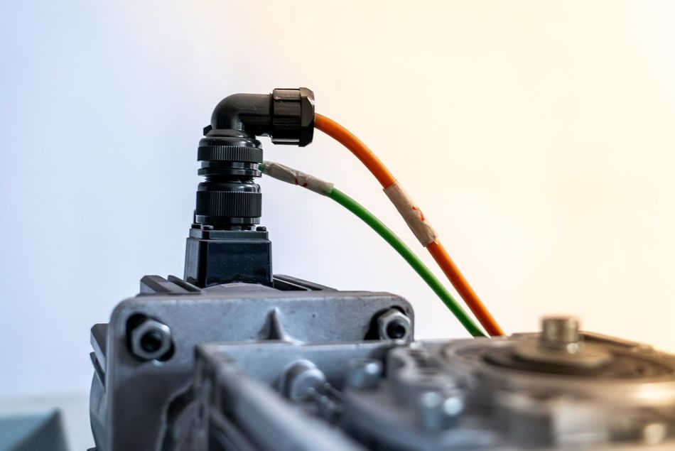 Industrial Servo Motor Connected with Bright Orange and Green Cables