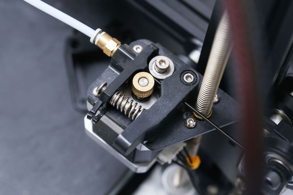 3D printer extruder closeup showing stepper motor