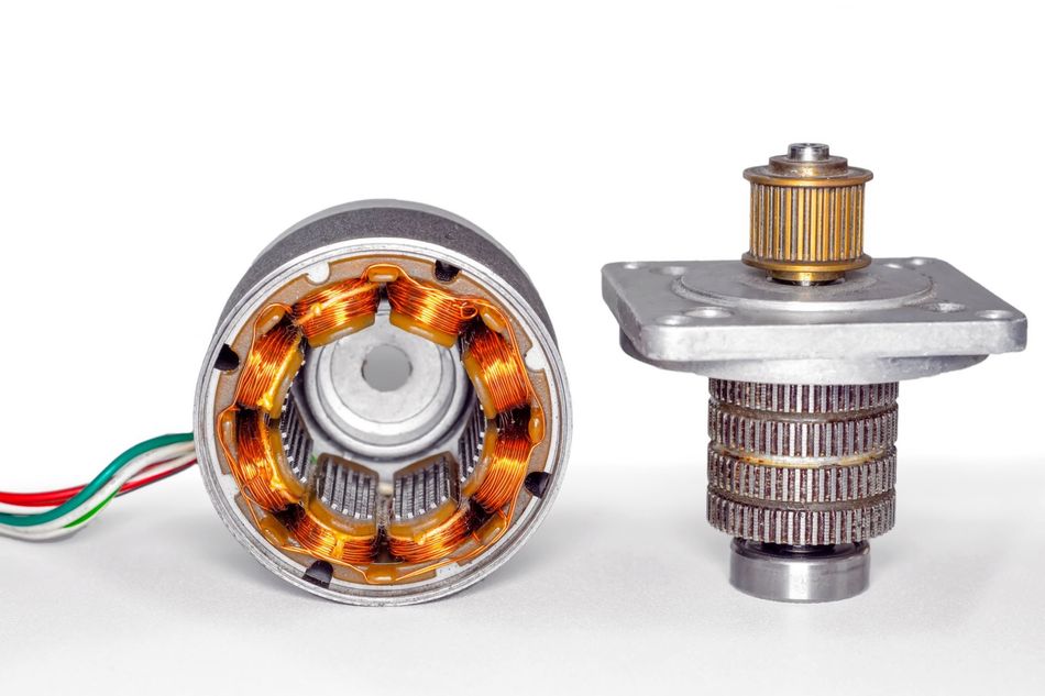 Stepper motor, disassembled, with the rotor set aside
