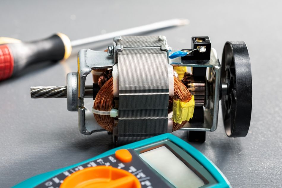 Exposed Electric Motor Assembly alongside Diagnostic Tools
