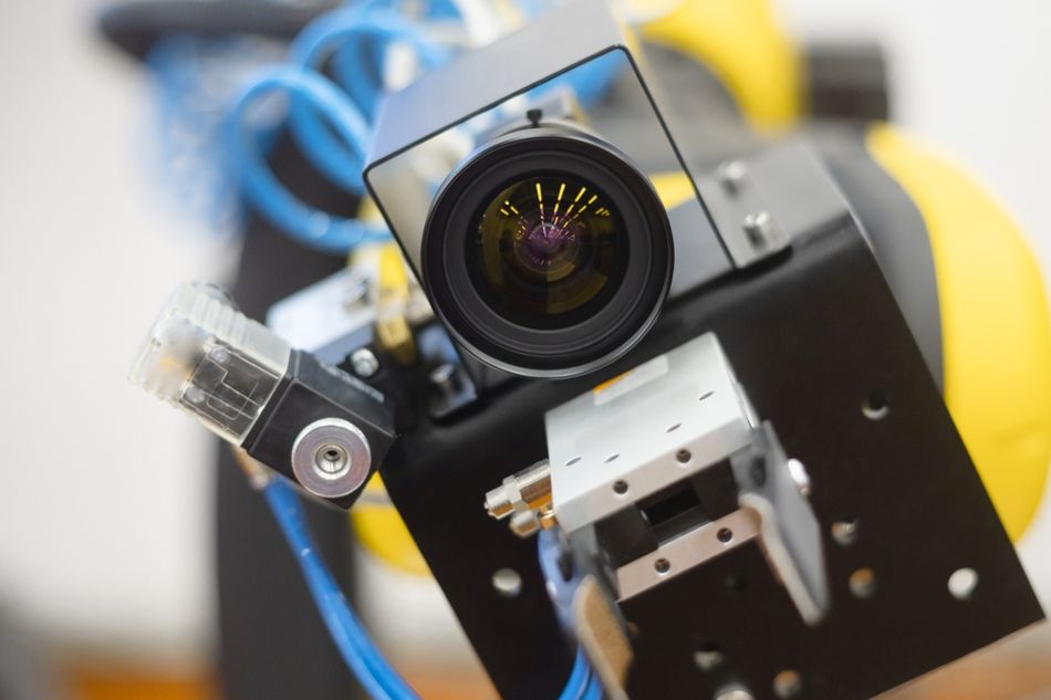 Fig 1: A typical machine vision lens installed on a robot