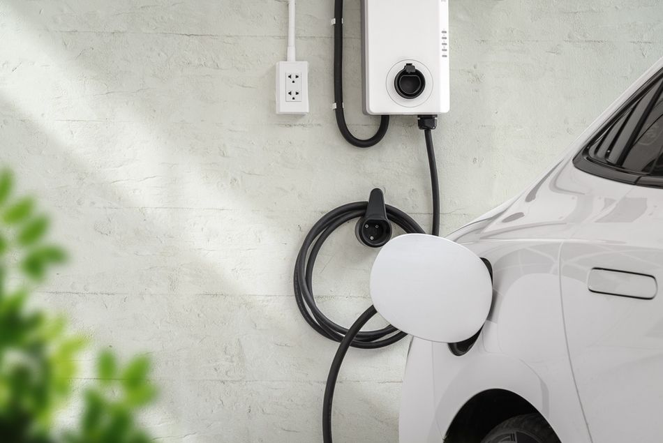 Electric Vehicle Charging at Home with Wall Mounted Charger and Cable