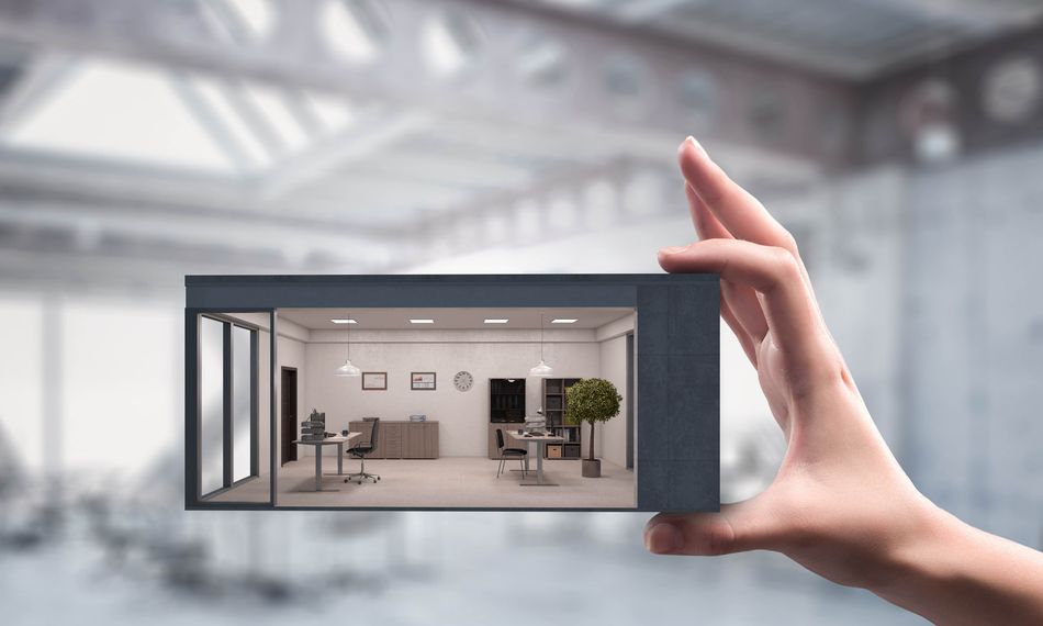 3D rendering of a hand holding a scaled-down cross-section of a modern office interior