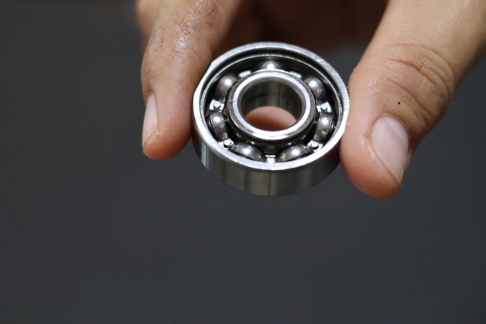 A ball bearing held between finger and thumb