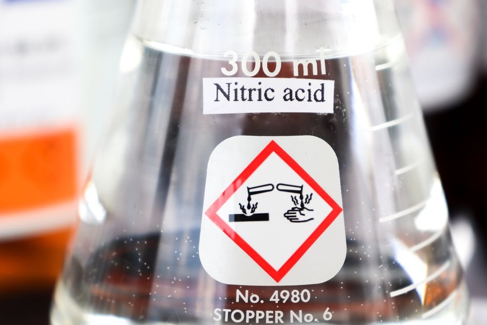 Glass beaker of nitric acid