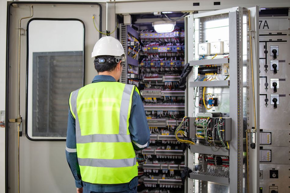 Electrical Inspection Substation Professional inspecting Industrial Control Panel