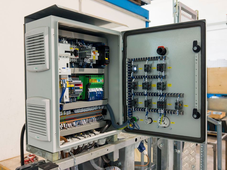 Open Industrial Electrical Control Panel showing Terminal Blocks, DIN Rails, and Organized Wiring